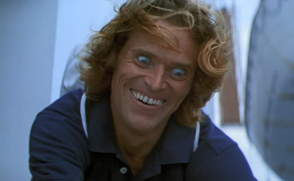 Willem Dafoe with crazed look on face
